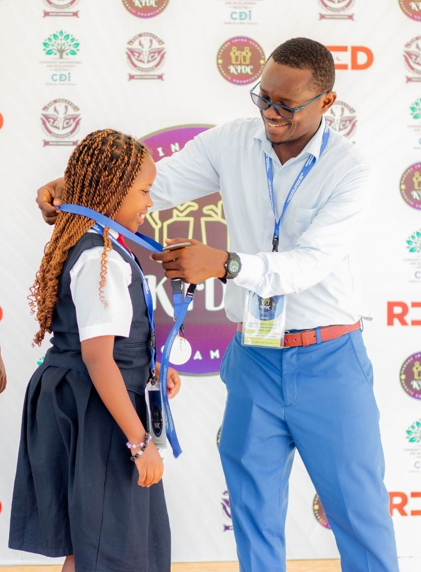 KIDCS participant receiving a medal